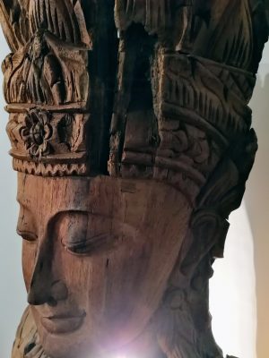 Beautifully carved face with light bursting through
